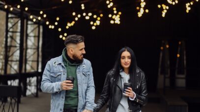 Outdoor happy couple in love posing near cafe